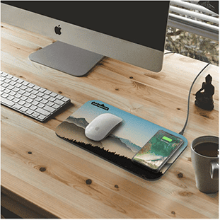 Photo of a charging mouse pad at a desk.